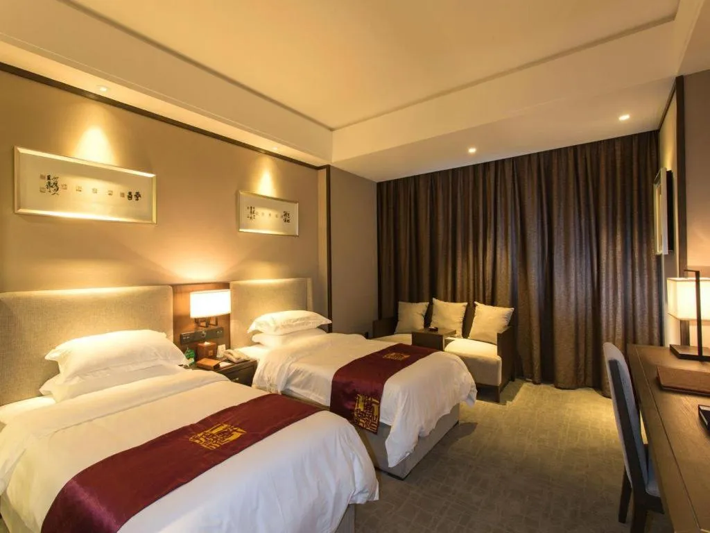 Bed in Zhuhai Starlight Hotel