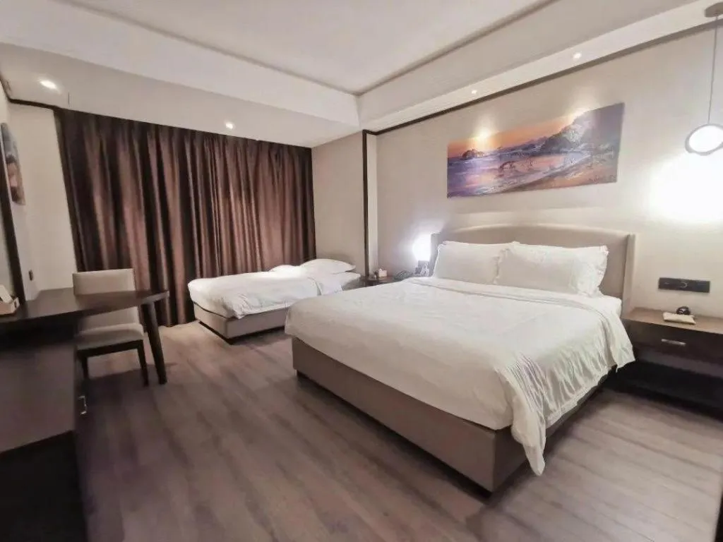 Bed in Zhuhai Starlight Hotel