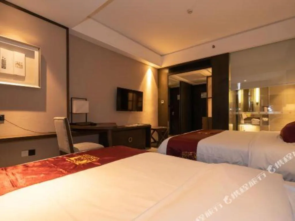Bed in Zhuhai Starlight Hotel