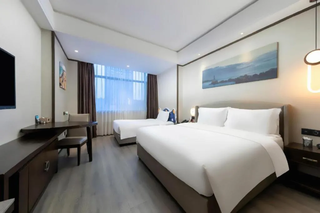 Bed in Zhuhai Starlight Hotel