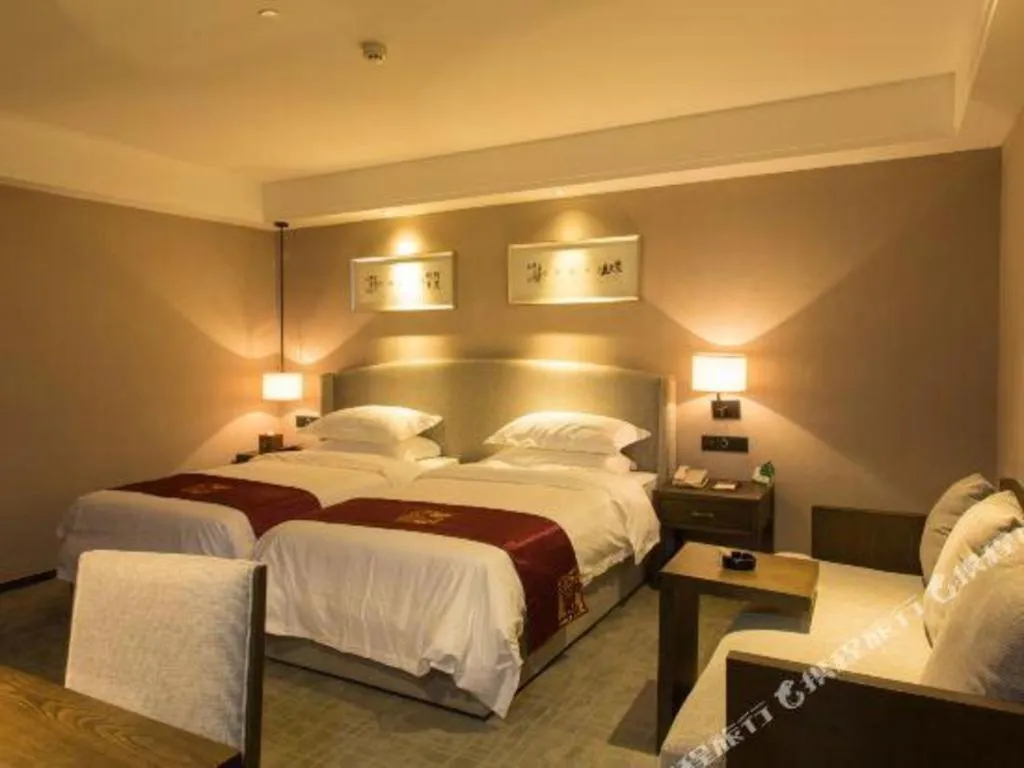 Bed in Zhuhai Starlight Hotel