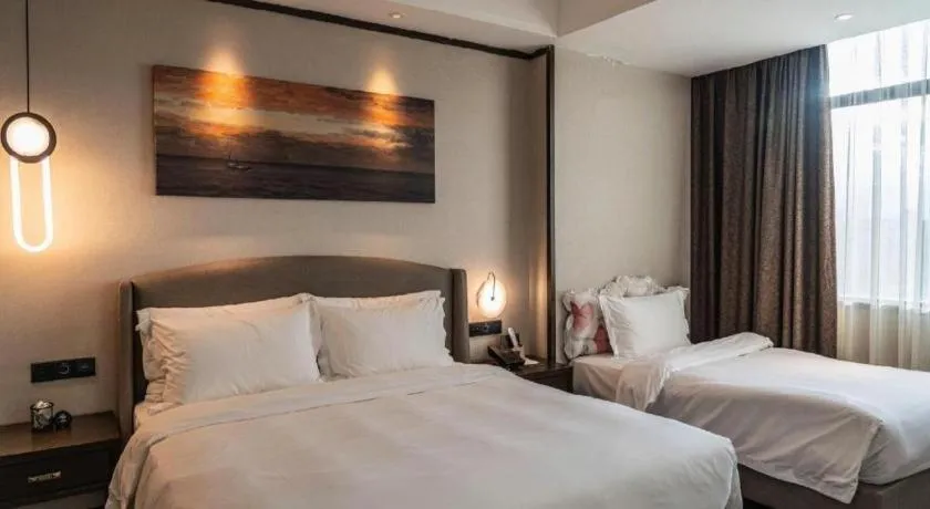 Bed in Zhuhai Starlight Hotel