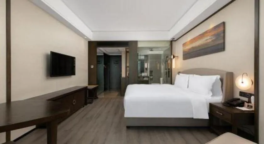 Bed in Zhuhai Starlight Hotel