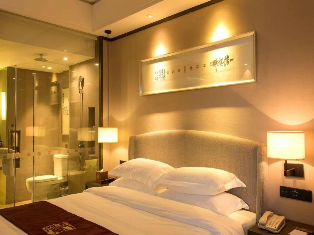 Bed in Zhuhai Starlight Hotel