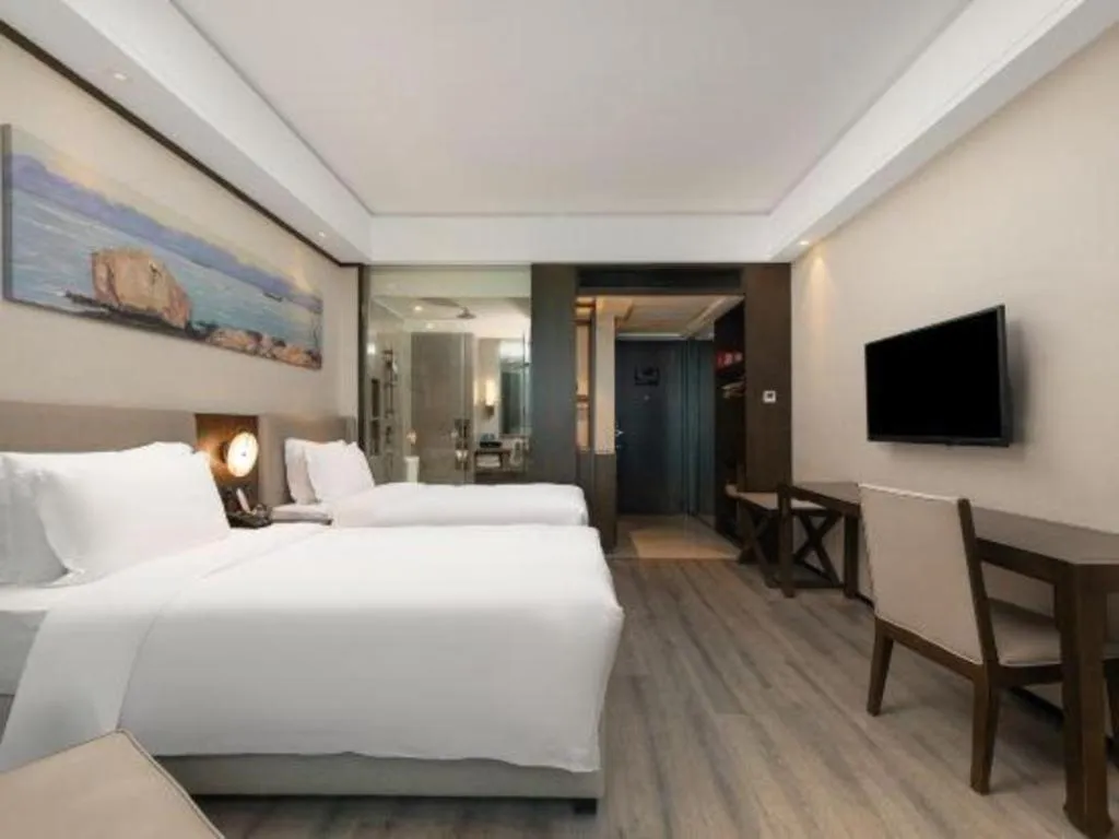 Bed in Zhuhai Starlight Hotel