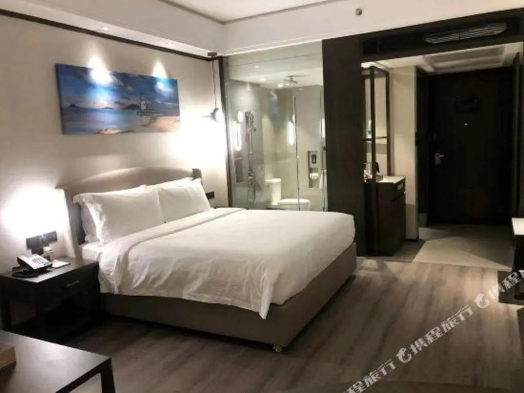 Bed in Zhuhai Starlight Hotel