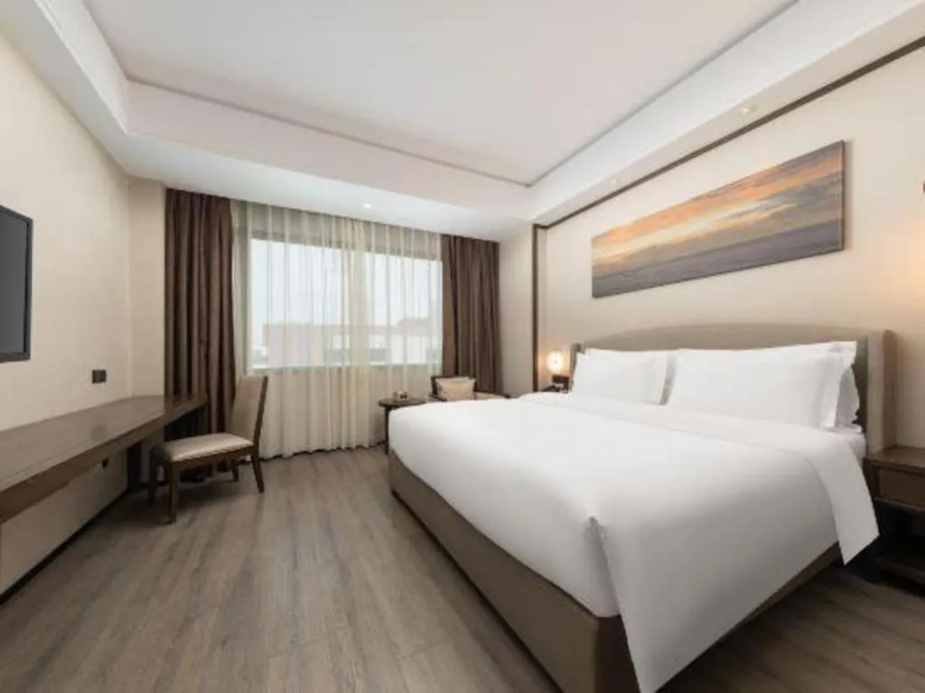 Bed in Zhuhai Starlight Hotel
