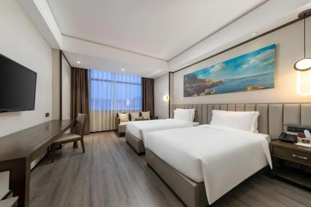 Bed in Zhuhai Starlight Hotel