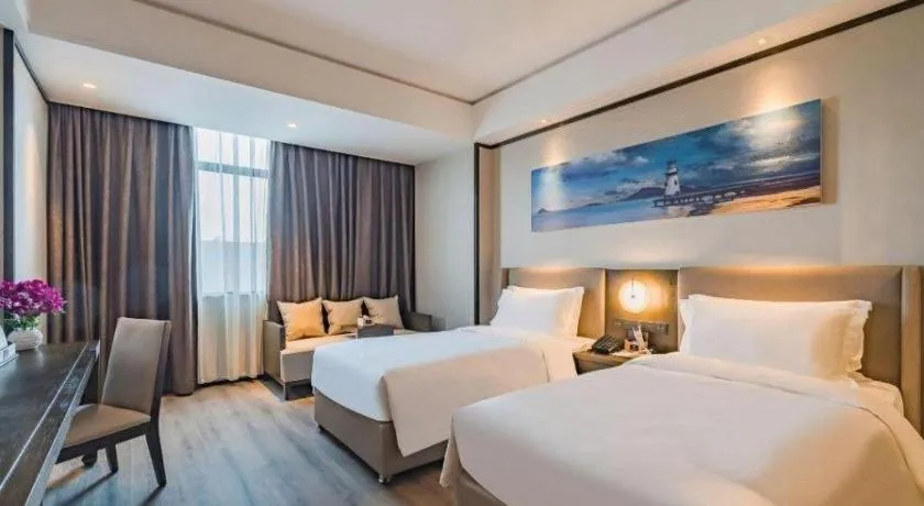 Bed in Zhuhai Starlight Hotel