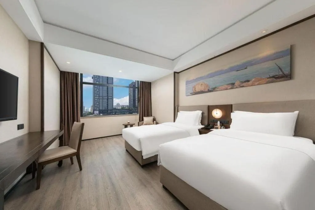 Bed in Zhuhai Starlight Hotel