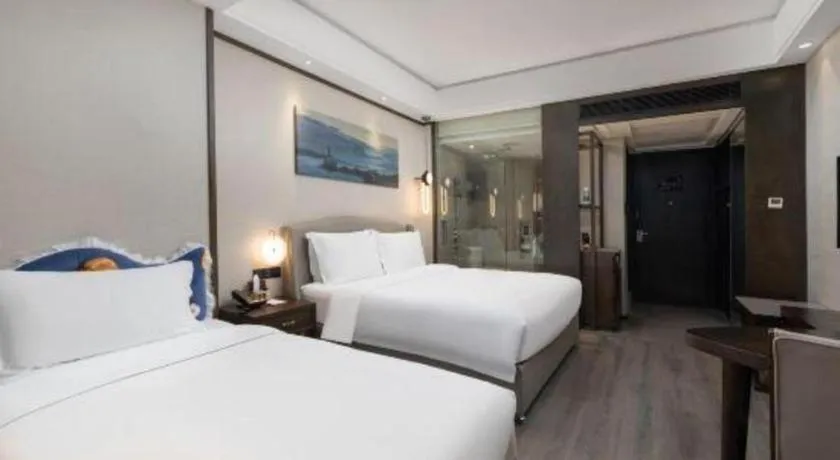 Bed in Zhuhai Starlight Hotel
