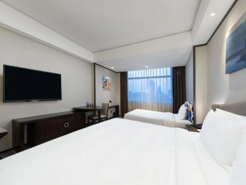 Bed in Zhuhai Starlight Hotel