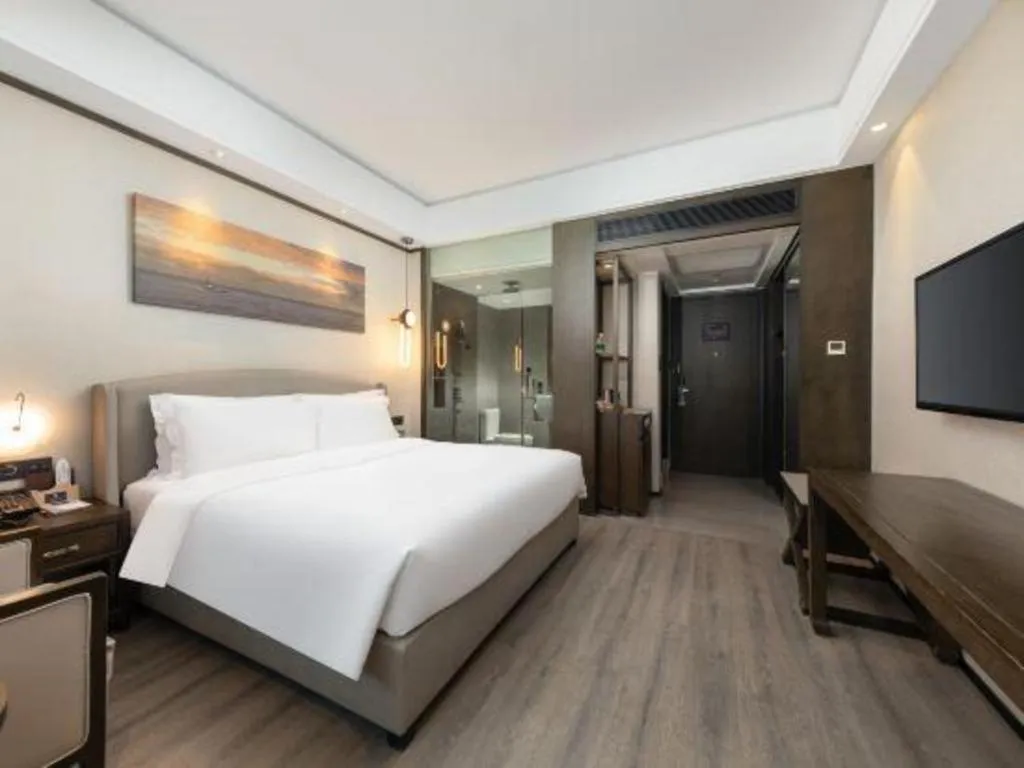 Bed in Zhuhai Starlight Hotel