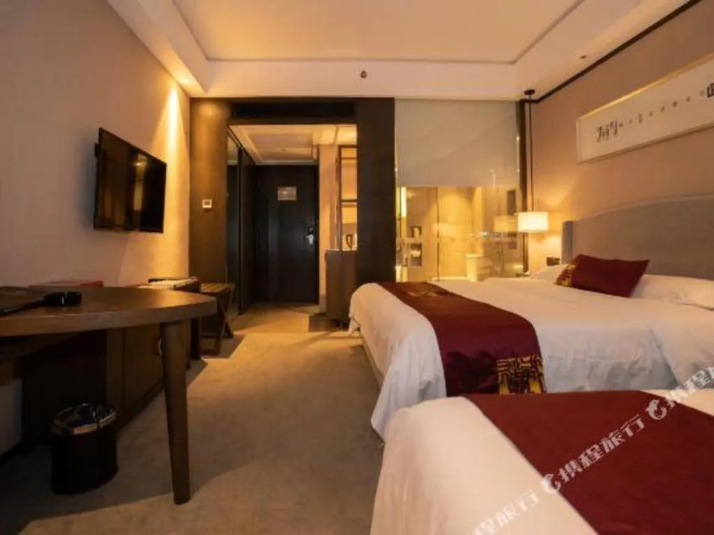 Bed in Zhuhai Starlight Hotel