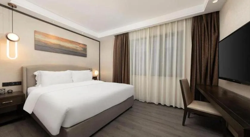 Bed in Zhuhai Starlight Hotel