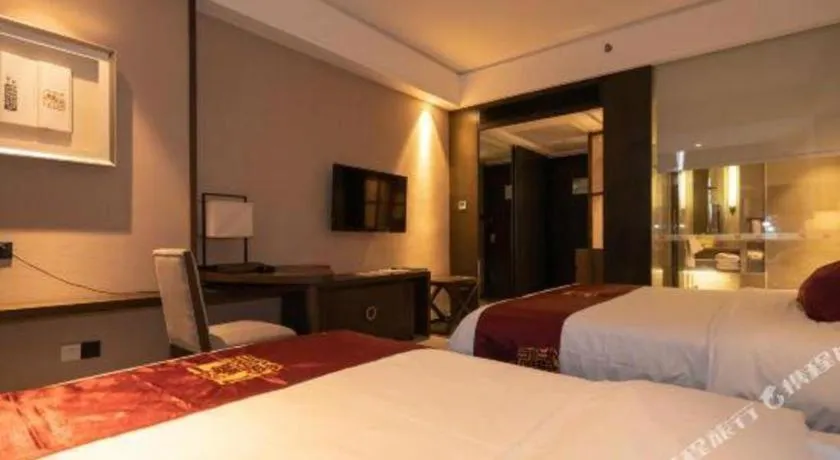 Bed in Zhuhai Starlight Hotel