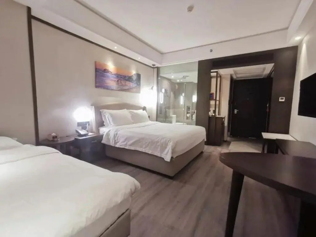 Bed in Zhuhai Starlight Hotel