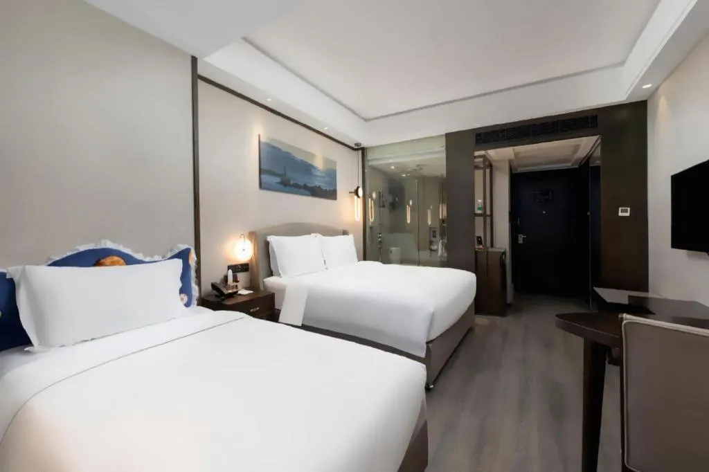 Bed in Zhuhai Starlight Hotel
