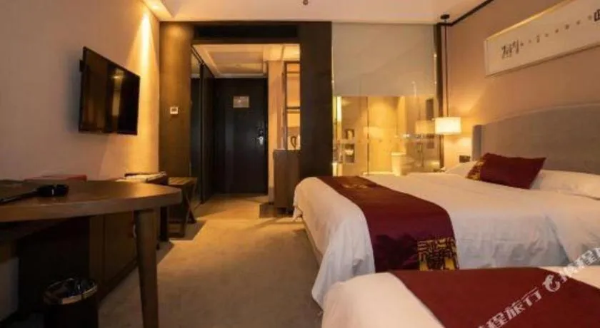 Bed in Zhuhai Starlight Hotel