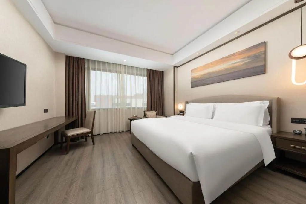 Bed in Zhuhai Starlight Hotel