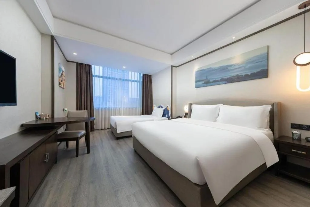 Bed in Zhuhai Starlight Hotel