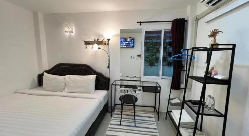 Bed in Ban Thungdang Housetel Bangkok