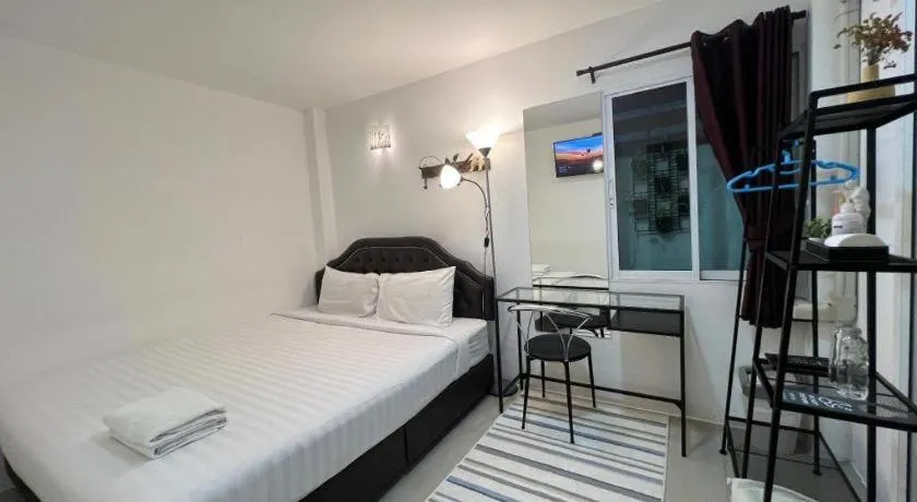 Bed in Ban Thungdang Housetel Bangkok
