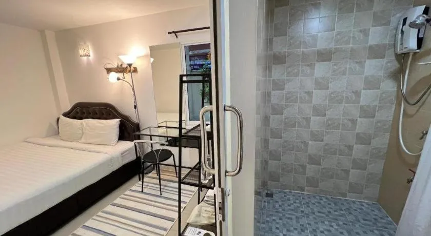 Bed in Ban Thungdang Housetel Bangkok