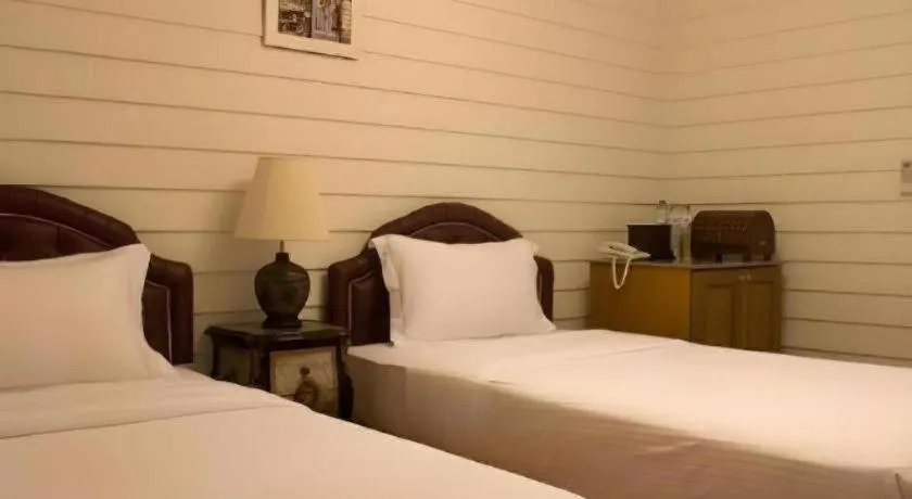 Bed in Ban Thungdang Housetel Bangkok