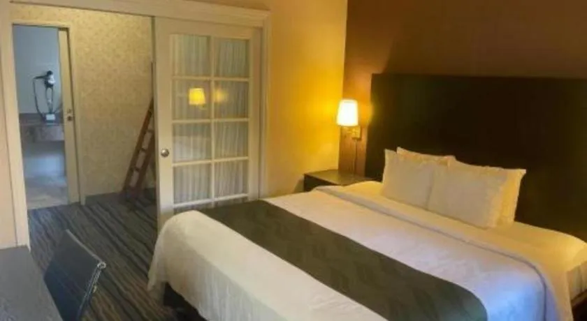 Bed in Ramada Suites by Wyndham San Diego