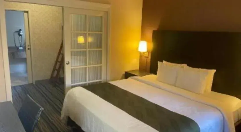 Bed in Ramada Suites by Wyndham San Diego Bed in Ramada Suites by Wyndham San Diego