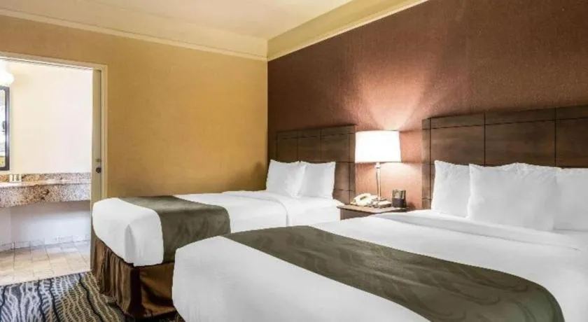 Bed in Ramada Suites by Wyndham San Diego