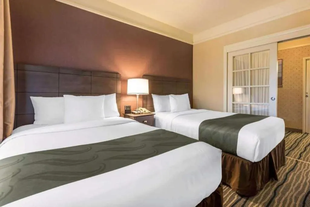 Bed in Ramada Suites by Wyndham San Diego