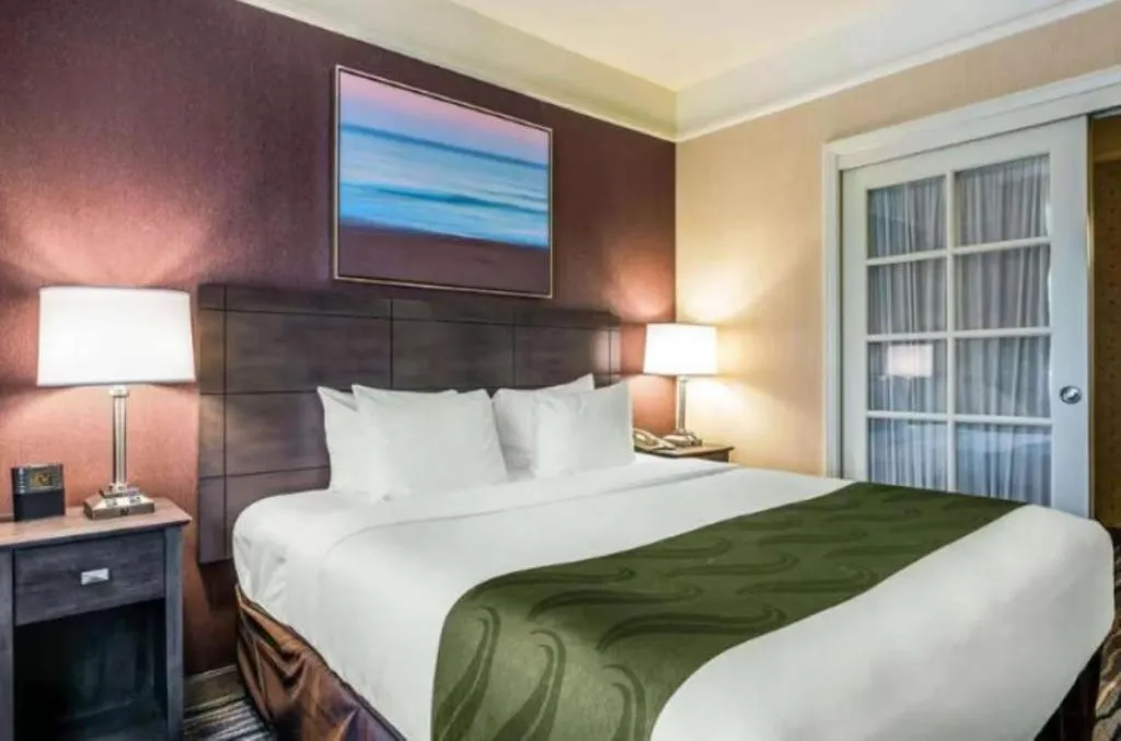 Bed in Ramada Suites by Wyndham San Diego