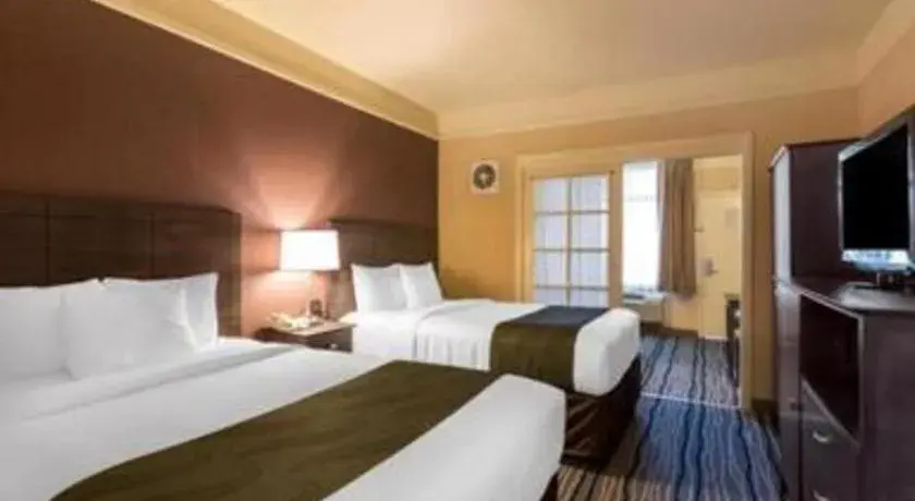 Bed in Ramada Suites by Wyndham San Diego Bed in Ramada Suites by Wyndham San Diego