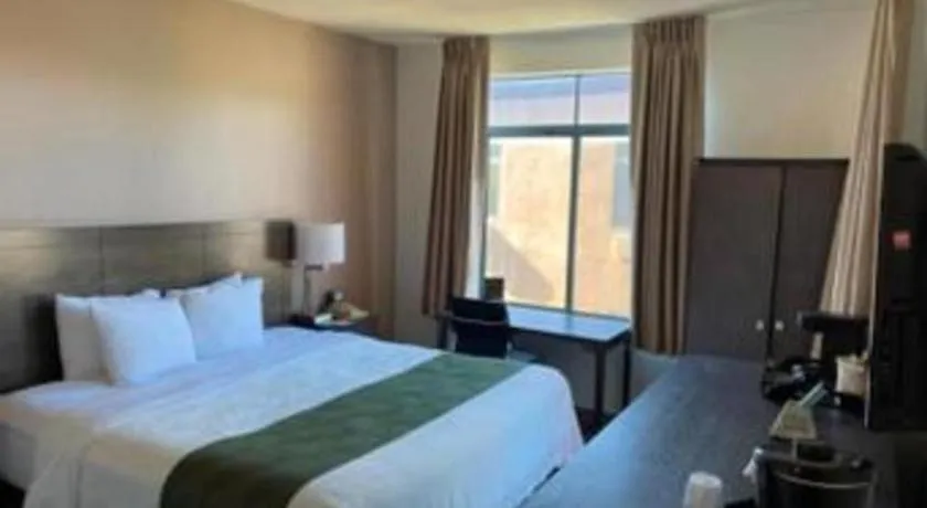 Bed in Ramada Suites by Wyndham San Diego