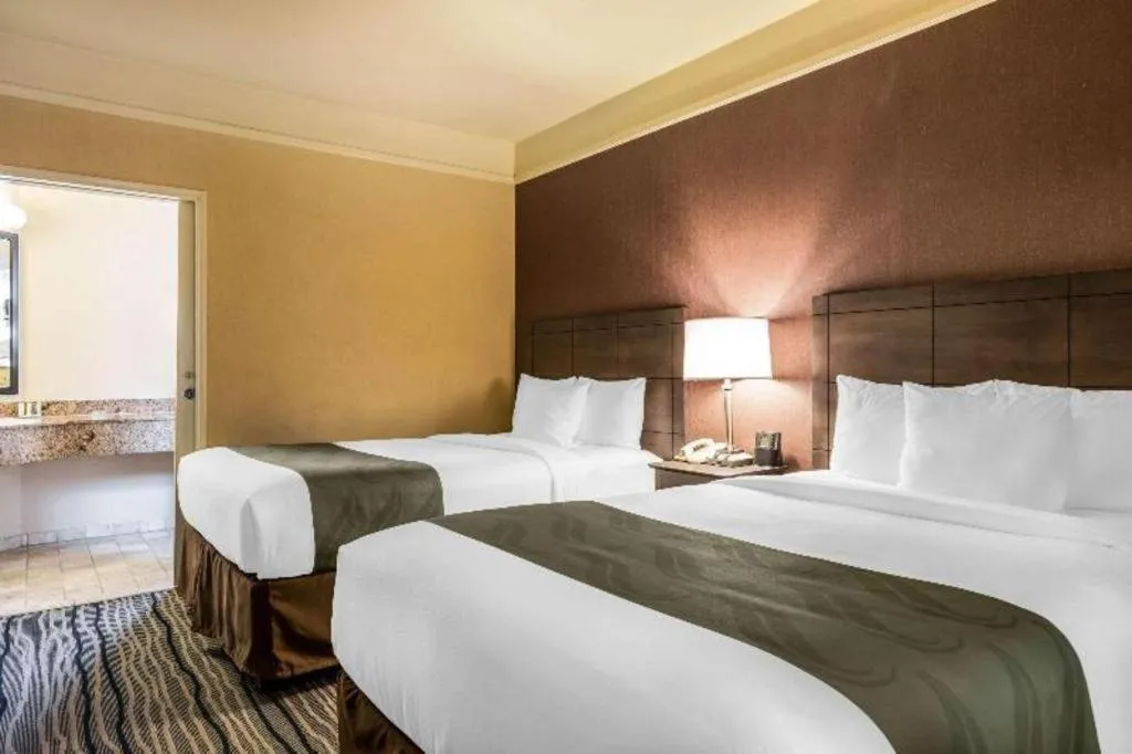 Bed in Ramada Suites by Wyndham San Diego