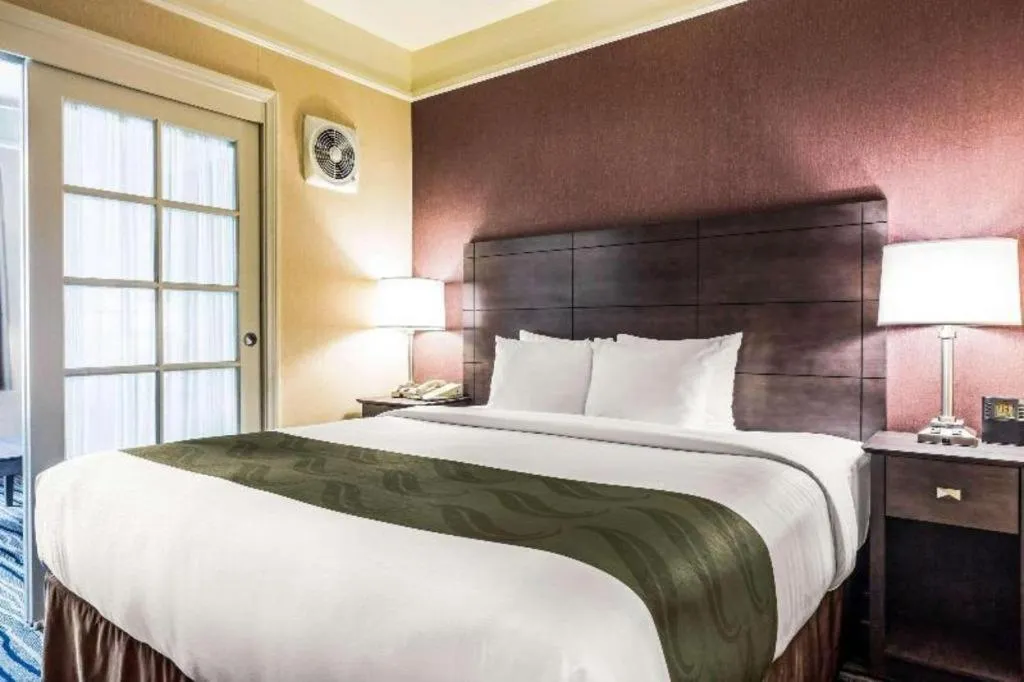 Bed in Ramada Suites by Wyndham San Diego