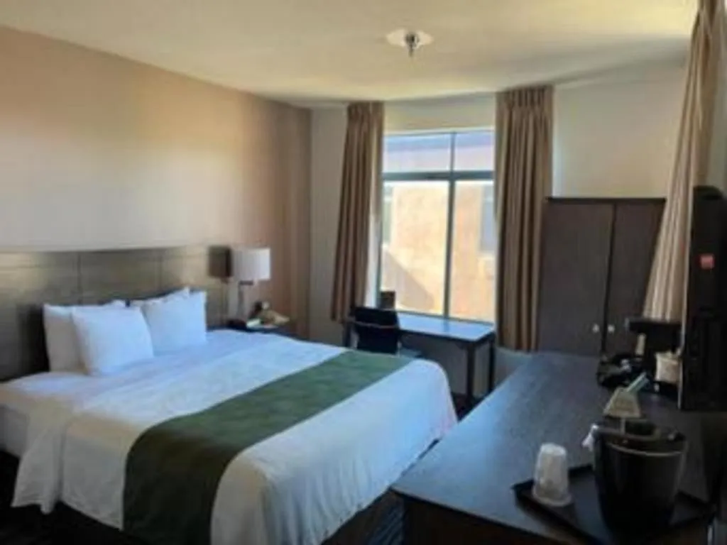 Bed in Ramada Suites by Wyndham San Diego