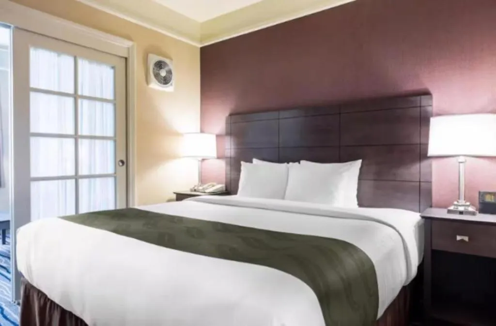 Bed in Ramada Suites by Wyndham San Diego