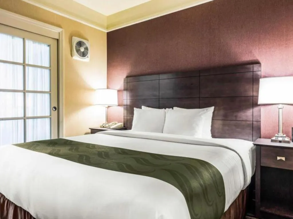 Bed in Ramada Suites by Wyndham San Diego