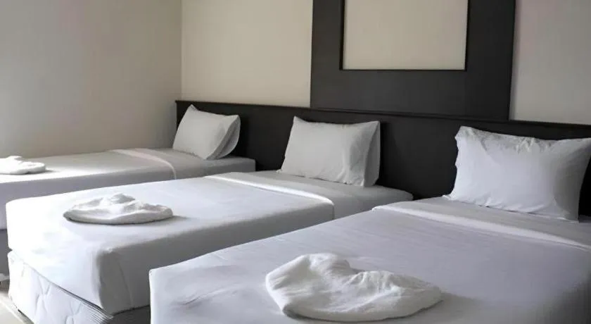 Bed in Grand Pinnacle Hotel