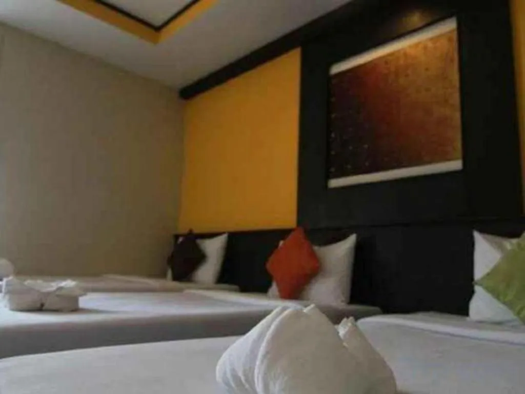 Bed in Grand Pinnacle Hotel