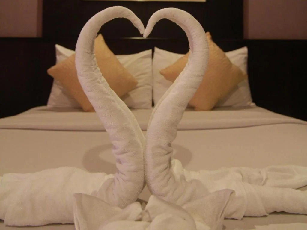 Bed in Grand Pinnacle Hotel