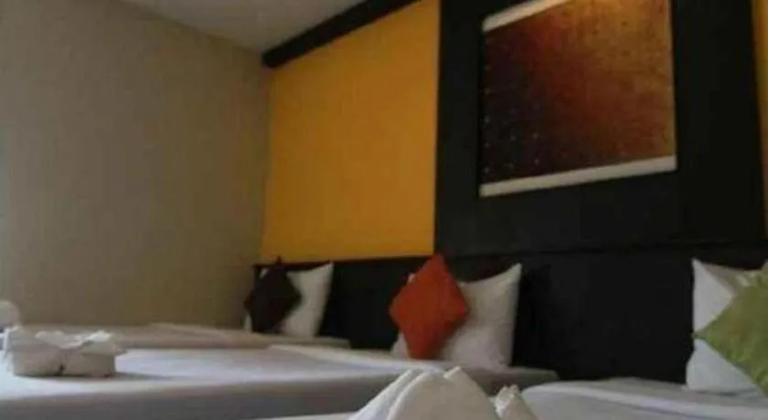 Bed in Grand Pinnacle Hotel