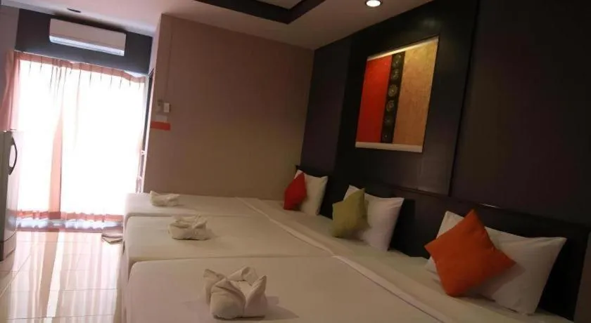 Bed in Grand Pinnacle Hotel
