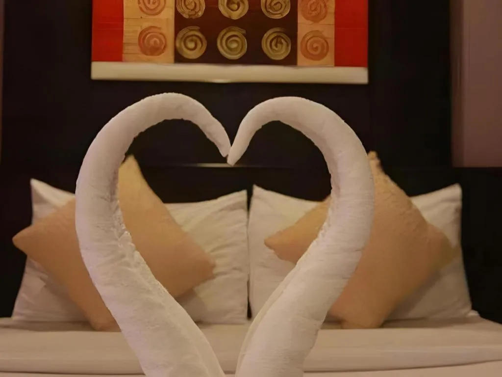 Bed in Grand Pinnacle Hotel