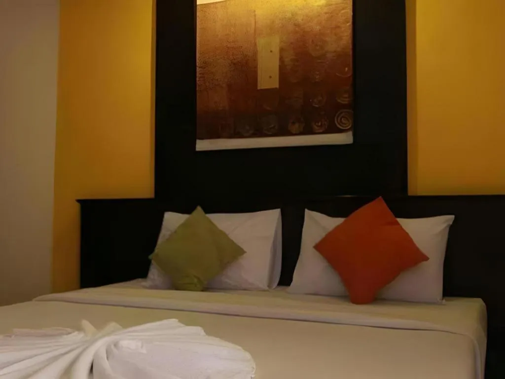 Bed in Grand Pinnacle Hotel