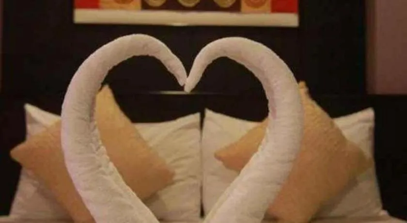 Bed in Grand Pinnacle Hotel