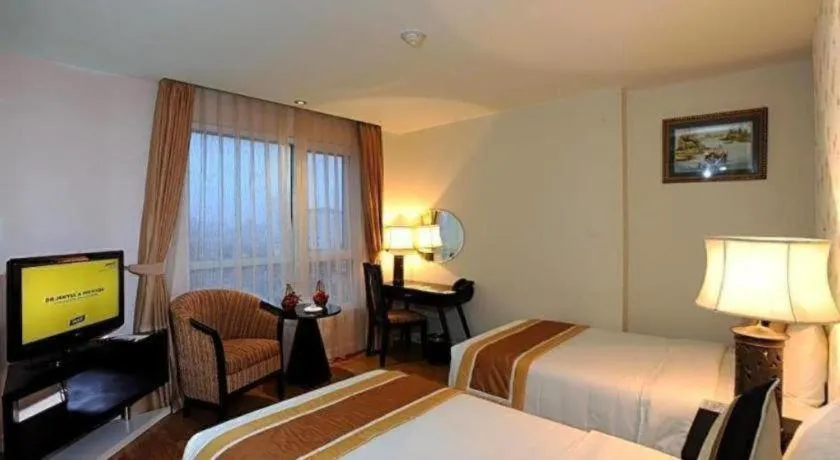 Bed in Cosiana Hotel